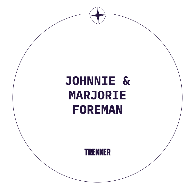 This image features a circular design with the names "JOHNNIE & MARJORIE FOREMAN" prominently displayed in the center. Below their names, the word "TREKKER" is written. The overall aesthetic is minimalist, with a compass-like symbol at the top, suggesting themes of travel or guidance. The color palette is simple, focusing on dark text against a white background within a thin purple border.