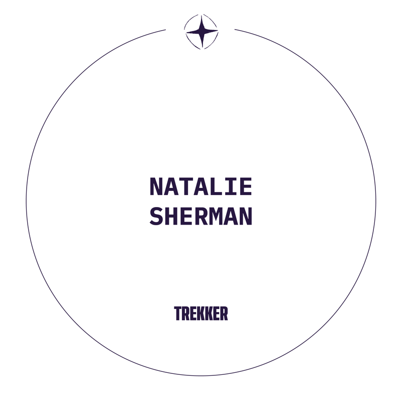 This is a minimalist graphic featuring the name NATALIE SHERMAN in large, dark purple capital letters centered within a thin, dark purple circle. Below her name, also in capital letters, is the word TREKKER. A small, dark purple compass rose symbol is positioned at the top center of the circle. The background is plain white.